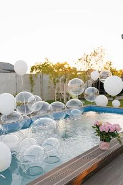 Floating transparent bubbles in swimming pool decoration Stock-Fotos