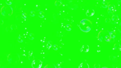 Floating transparent soap bubbles rising slowly against a bright green screen Stock Footage 340613111