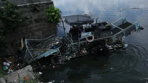 Floating trash collection vessels cleans hussain sagar lake Stock Footage 161334837