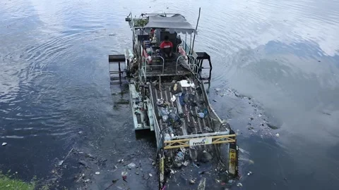 Floating trash collection vessels cleans hussain sagar lake Stock Footage 161334874