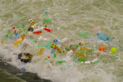Floating trash in river Foto stock