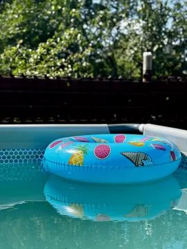 Floating Tube in Refreshing Pool Stock Photos