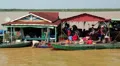 Floating village of Vietnamese refugees on Tonle Sap lake in Siem Reap, Cambodia HD Footage