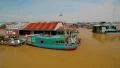 Floating village of Vietnamese refugees on Tonle Sap lake in Siem Reap, Cambodia HD Footage