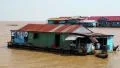 Floating village of Vietnamese refugees on Tonle Sap lake in Siem Reap, Cambodia HD Footage