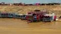 Floating village of Vietnamese refugees on Tonle Sap lake in Siem Reap, Cambodia HD Footage