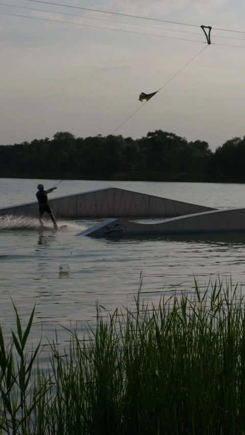 Floating Wakeboard Kickers and Sliders in Calm Outdoor Wake Park Stock-Footage 341986725