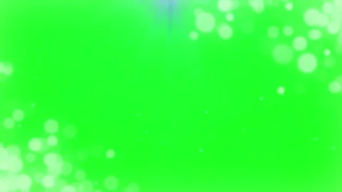 Floating white bokeh particles over vibrant green screen background overlay 库存影片 345214744
