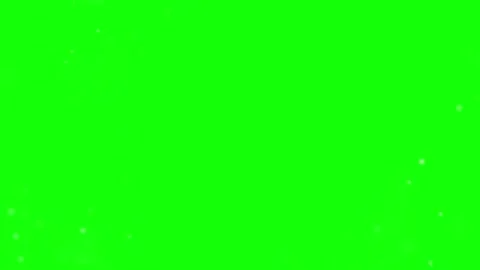 Floating white dust particles drifting slowly across vibrant green screen Stock Footage 346039986