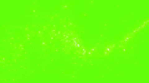 Floating white glowing dust particles drifting slowly across bright green 스톡 동영상 345135932