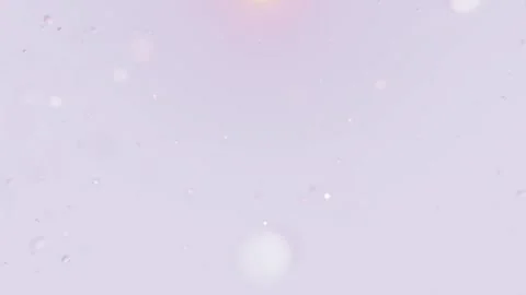 Floating white particles drifting over a soft lavender background with subtle Video stock 338995100