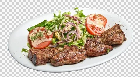 Floating White plate with lamb chops and salad Stock Photos