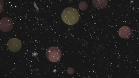 Floating white snow particles descending slowly against dark background with Stock Footage 340943223