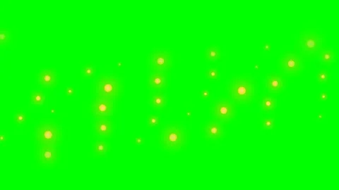 Floating yellow light particles rising against a vibrant green screen backg.. Vídeos de archivo 341823559