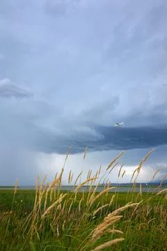 Floatplane and Storm Clouds vertical Fotos Stock