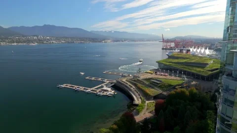 Floatplane Base, Burrard Landing Mall And Canada Place From Harbour Green Park Stock Footage 294887215