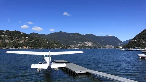 Floatplane floating on lake Como in Italy  during a sunny day Stock Footage 115675980