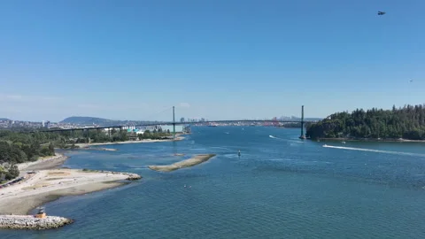 Floatplane Flying Over Burrard Inlet with Lions Gate Bridge and Vancouver S.. Stock Footage 329821019