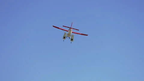 A floatplane flying through the blue sky Stock Footage 332044911