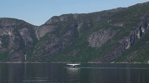 Floatplane taking off in fjord landscape Stock Footage 92841737