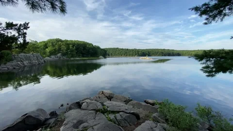 Floaty wide angle view of Idyllic and Pristine Lake on a beautiful summer day Stock Footage 137276100
