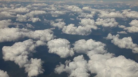 Flock of clouds from plane pan  - 2 shots  set Stock-Footage 83495968