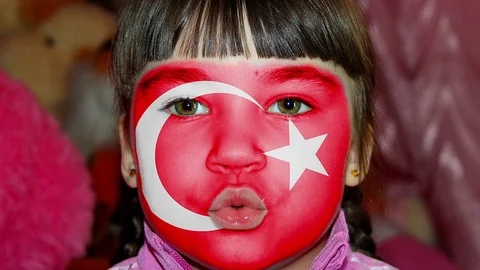 Flock of flags of the world on the face of a child Stock Footage 74387862