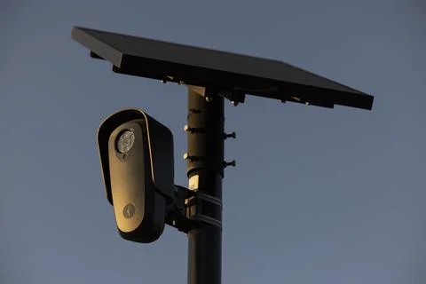 Flock Security Camera Sunset Stock Photos