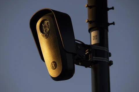 Flock Security Camera Sunset Stock Photos