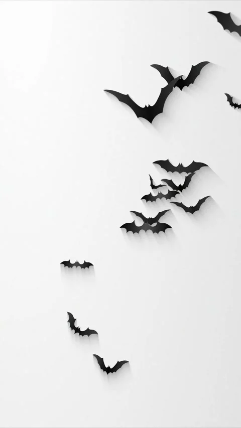 A flock of silhouetted bats in various sizes and orientations gracefully Stock Footage 317492885