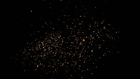 A flock of small golden balls of light emerge as if from a firecracker and Stock Footage 153767728