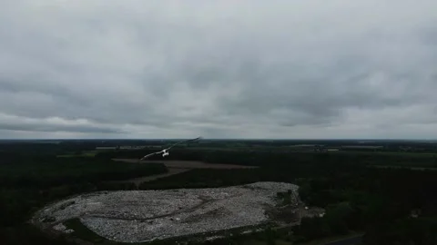 A flock of storks flying over the fields, cloudy weather, shooting from a drone Stock Footage 211367382