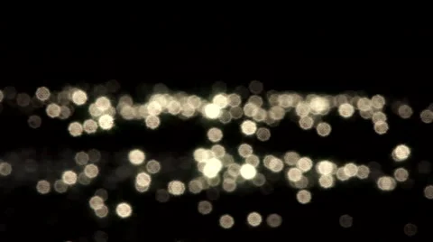 A flock of the sun specks on dark background. Water reflection. Stock Footage 40808409