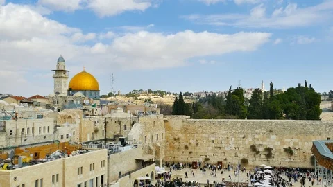 Flock of white doves over Jerusalem's western wall Stock Footage