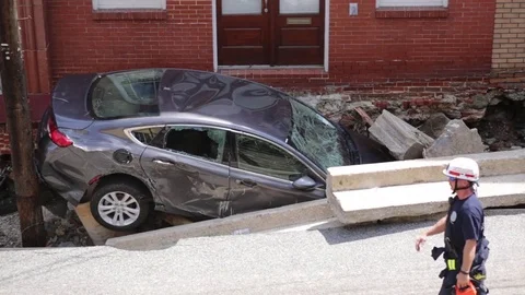 Flood damage destroyed building foundation and car. Ellicott City, Maryland. Stock Footage 70537542