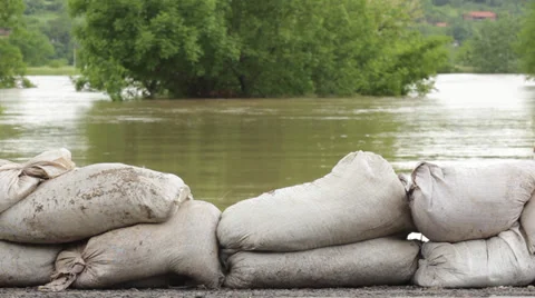Flood defense. Retaining wall made by stacking sandbags for floods protection. Stock Footage 38993625
