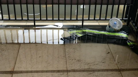 Flood in front of house, garage with garbage Stock Footage 306584440