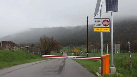 Flood gate down road closed Stock Footage 154522423