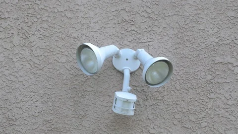 Flood light on the side of a home Stock Footage 128442970