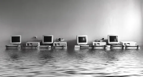 Flood in the office with computers Stock Photos