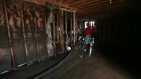 Flood pumping out mud and water damaged walls P HD 2091 Stock Footage 11504067