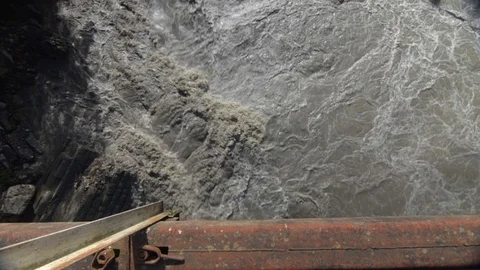 Flood water fast flowing down swollen mountain river in Georgia Stock Footage 76194849