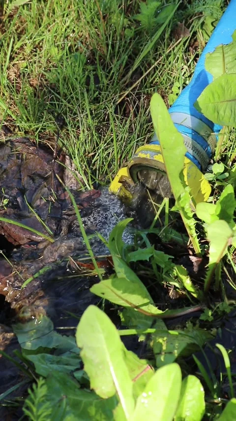 Flood water pumping down the drainage outdoors, vertical Video stock 246285122