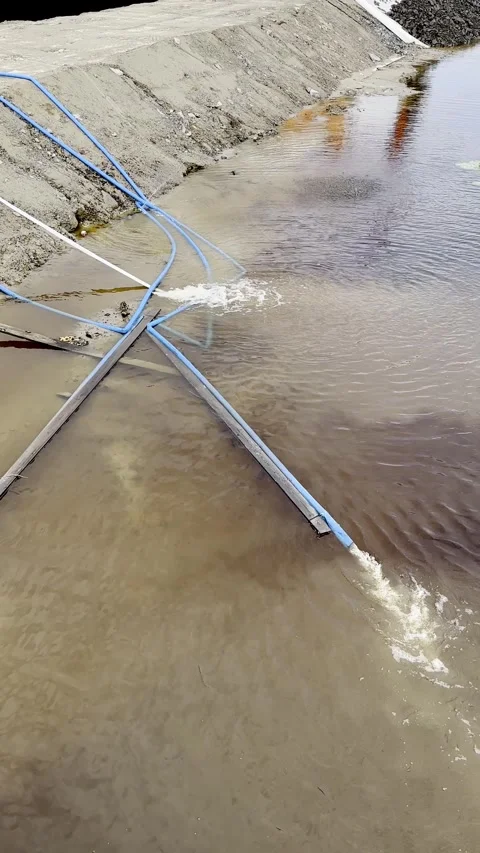 Flood water pumping down the leaking hoses outdoors, vertical Stock Footage 247322618