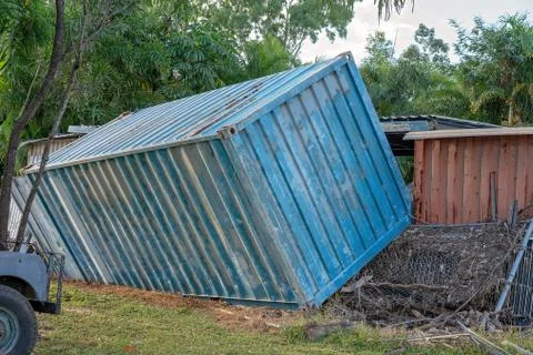 Flood Waters Pushed A Container On Its Side Stock Photos