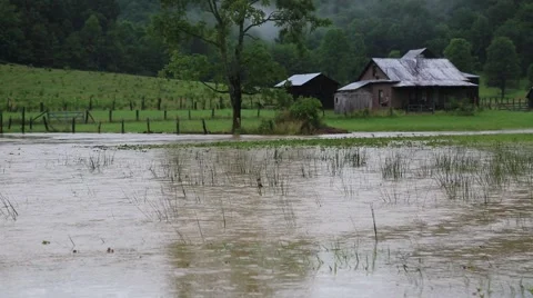 Flood Waters Surround Old Barn on Farm Stock Footage 64927083
