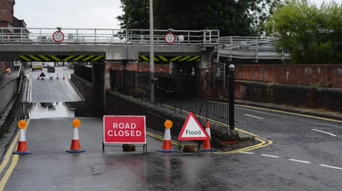Flooded and closed road under railway bridge selby uk Stock Footage 52888140