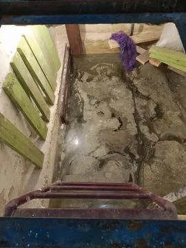 Flooded Basement Floor Viewed Through a Hatch Stock Photos