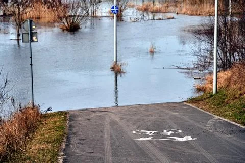 Flooded bicycle path on the Warta River in the city of Poznan Stock Photos
