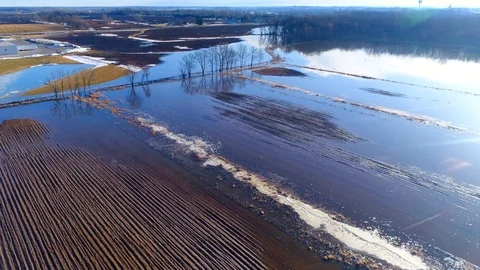 Flooded farm fields in Springtime flooding as snow melts Stock Footage 89174544